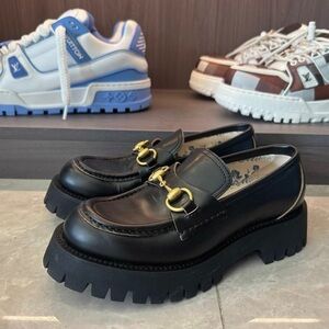 Gucci Black Leather Loafers with Gold Accents